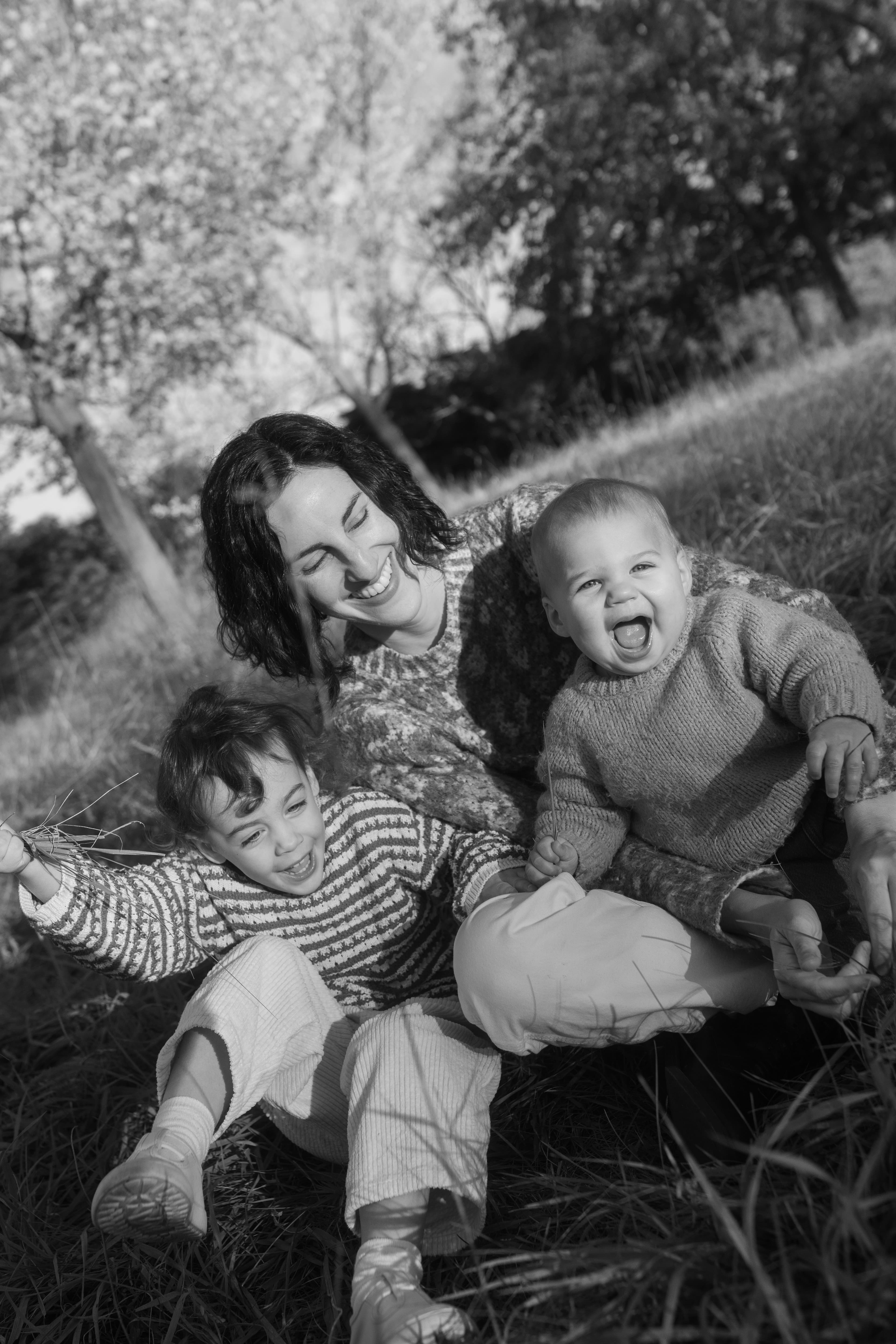 Mother with two children laughing